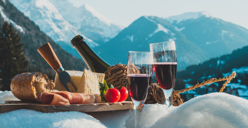 Fine Swiss food and wine in front of the mountains