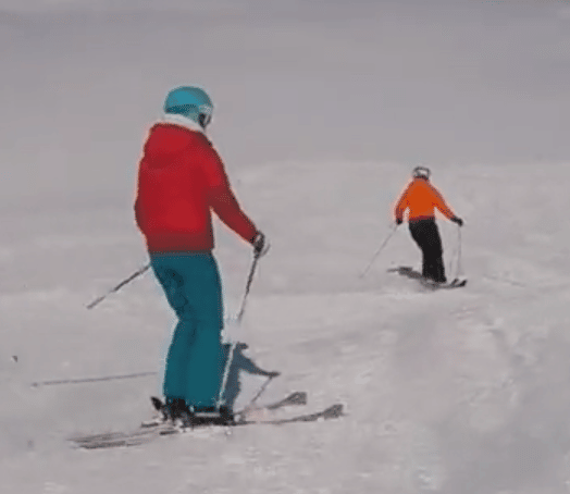 two skiiers